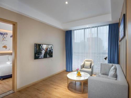 Imagen de la habitación del Hotel Kyriad Hanzhong Railway Station. Foto 17