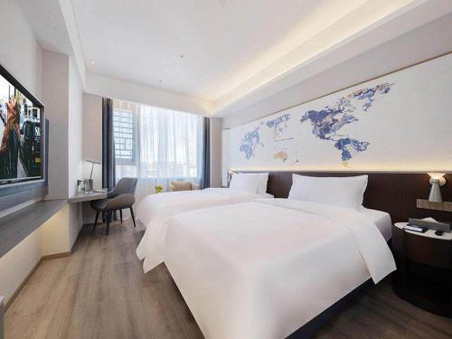 Imagen de la habitación del Hotel Kyriad Jieyang Wanda Plaza. Foto 17