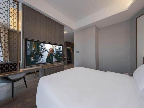 Imagen de la habitación del Hotel Kyriad Jieyang Wanda Plaza. Foto 18