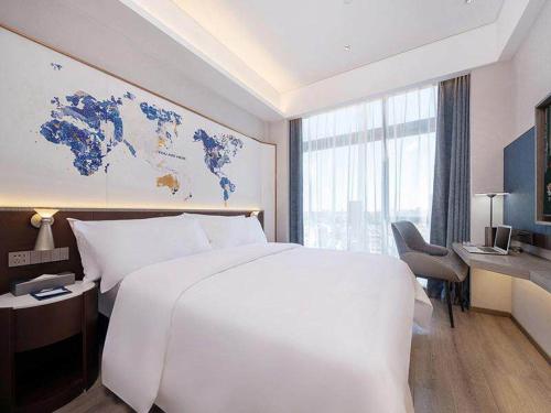 Imagen de la habitación del Hotel Kyriad Jieyang Wanda Plaza. Foto 20