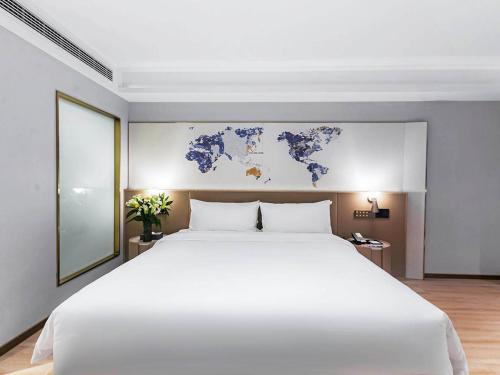 Imagen general del Hotel Kyriad Jiujiang Happy City. Foto 8