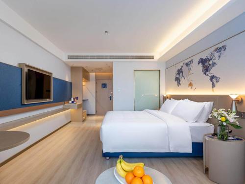 Imagen de la habitación del Hotel Kyriad Jiujiang Happy City. Foto 12