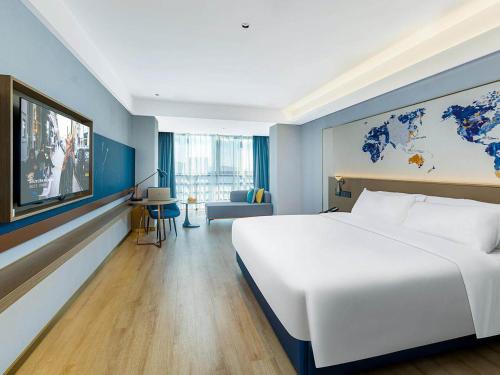 Imagen de la habitación del Hotel Kyriad Jiujiang Happy City. Foto 13