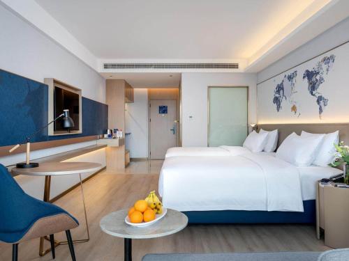 Imagen de la habitación del Hotel Kyriad Jiujiang Happy City. Foto 14