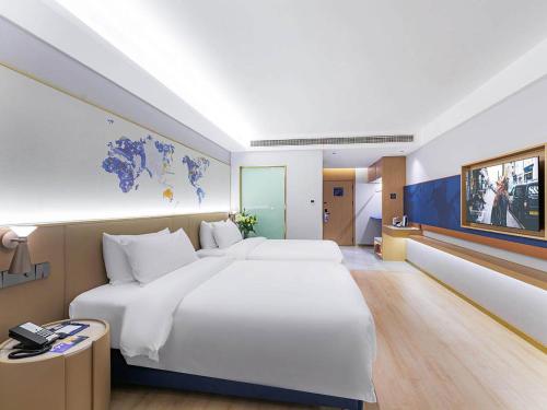 Imagen de la habitación del Hotel Kyriad Jiujiang Happy City. Foto 15