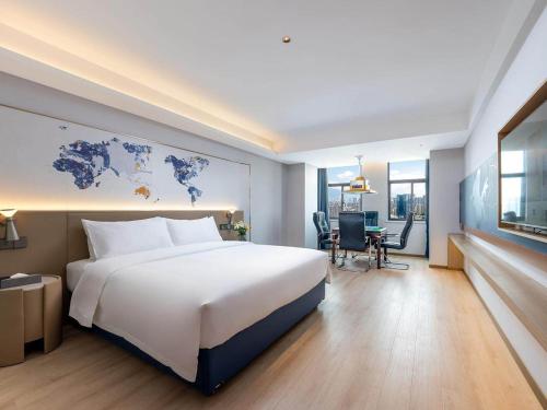 Imagen de la habitación del Hotel Kyriad Jiujiang Happy City. Foto 16