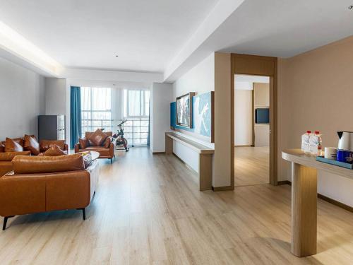 Imagen de la habitación del Hotel Kyriad Jiujiang Happy City. Foto 17