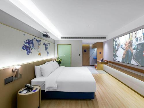 Imagen de la habitación del Hotel Kyriad Jiujiang Happy City. Foto 18