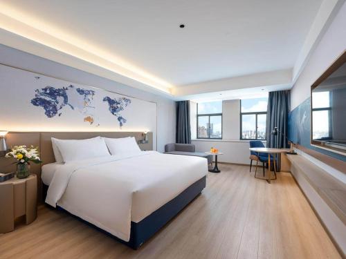 Imagen de la habitación del Hotel Kyriad Jiujiang Happy City. Foto 19