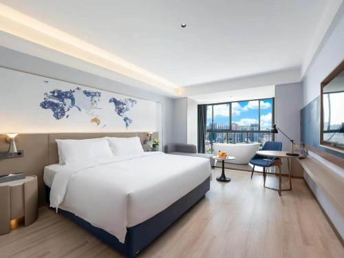 Imagen de la habitación del Hotel Kyriad Jiujiang Happy City. Foto 20