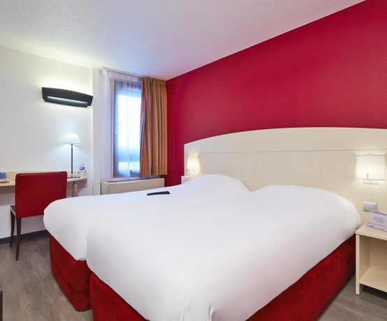 Imagen de la habitación del Hotel Kyriad Lyon Sud Saint Genis Laval. Foto 8