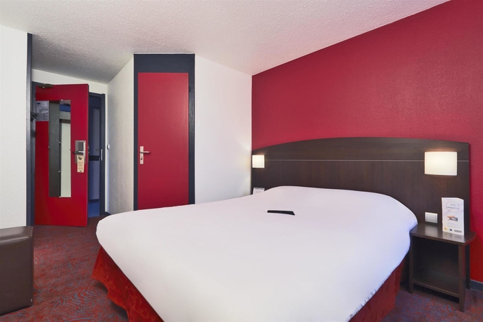 Imagen de la habitación del Hotel Kyriad Lyon Sud Saint Genis Laval. Foto 10