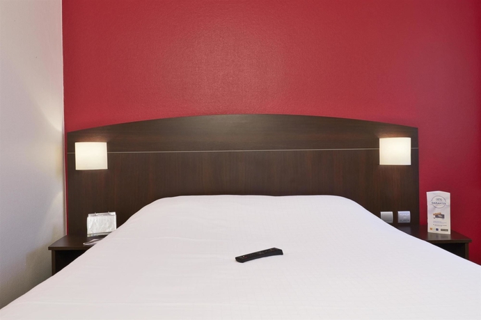 Imagen de la habitación del Hotel Kyriad Lyon Sud Saint Genis Laval. Foto 11