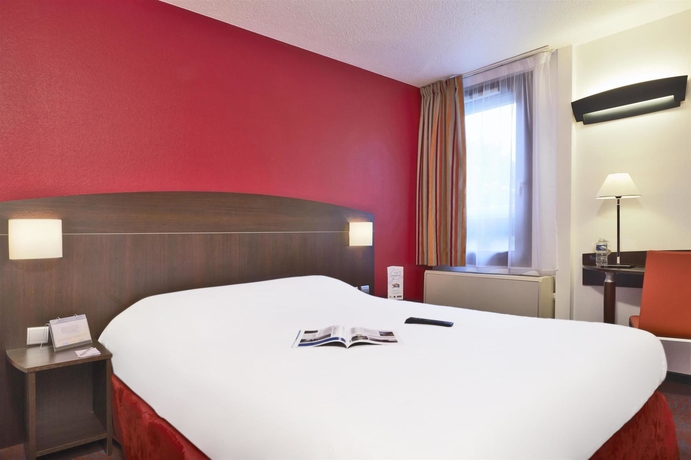 Imagen de la habitación del Hotel Kyriad Lyon Sud Saint Genis Laval. Foto 13