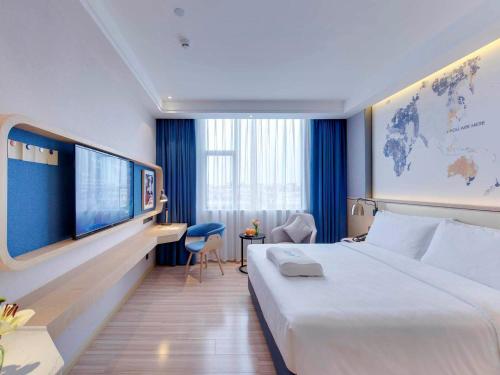 Imagen de la habitación del Hotel Kyriad Marvelous Guangzhou Baiyun International Airport. Foto 15