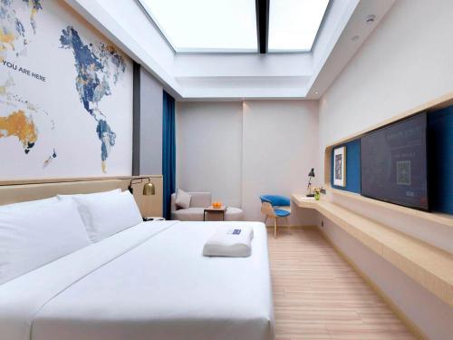 Imagen de la habitación del Hotel Kyriad Marvelous Guangzhou Baiyun International Airport. Foto 17