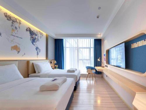 Imagen de la habitación del Hotel Kyriad Marvelous Guangzhou Baiyun International Airport. Foto 19