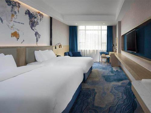 Imagen de la habitación del Hotel Kyriad Marvelous Guangzhou North Railway Station. Foto 14