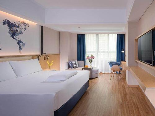 Imagen de la habitación del Hotel Kyriad Marvelous Haikou Free Trade Zone. Foto 11