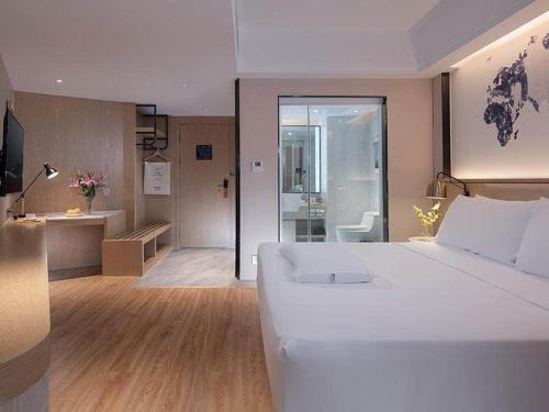 Imagen de la habitación del Hotel Kyriad Marvelous Haikou Free Trade Zone. Foto 12