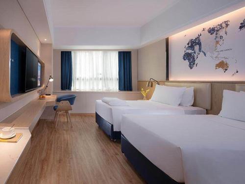 Imagen de la habitación del Hotel Kyriad Marvelous Haikou Free Trade Zone. Foto 13