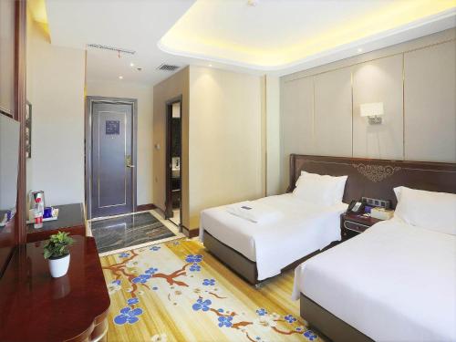 Imagen de la habitación del Hotel Kyriad Marvelous Harbin Railway Station Central Avenue. Foto 13