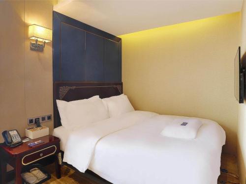 Imagen de la habitación del Hotel Kyriad Marvelous Harbin Railway Station Central Avenue. Foto 16