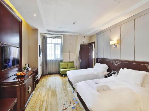 Imagen de la habitación del Hotel Kyriad Marvelous Harbin Railway Station Central Avenue. Foto 17
