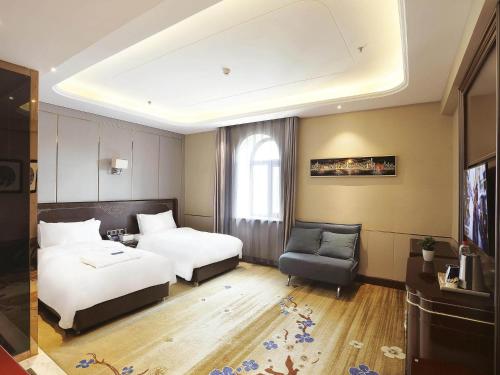 Imagen de la habitación del Hotel Kyriad Marvelous Harbin Railway Station Central Avenue. Foto 18