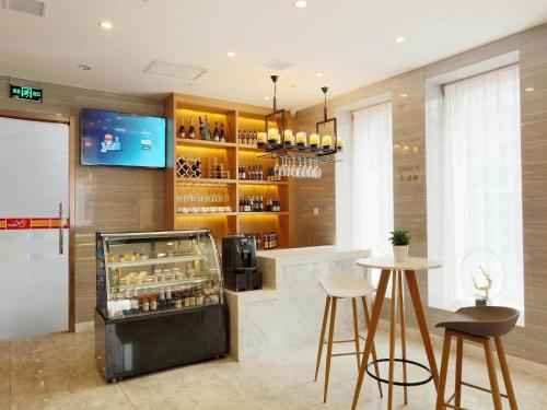 Imagen general del Hotel Kyriad Marvelous Harbin Railway Station Central Avenue. Foto 9