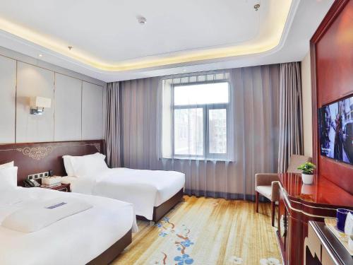 Imagen de la habitación del Hotel Kyriad Marvelous Harbin Railway Station Central Avenue. Foto 20
