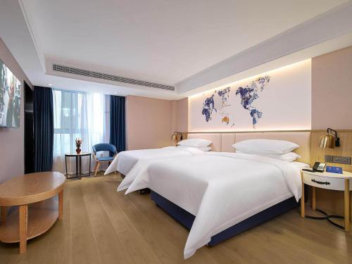 Imagen general del Hotel Kyriad Marvelous Henan Xinyang Pingqiao Plaza. Foto 1