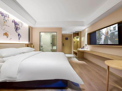 Imagen general del Hotel Kyriad Marvelous Henan Xinyang Pingqiao Plaza. Foto 9