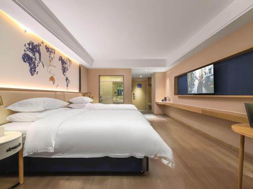 Imagen de la habitación del Hotel Kyriad Marvelous Henan Xinyang Pingqiao Plaza. Foto 14