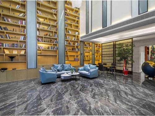 Imagen general del Hotel Kyriad Marvelous Henan Xinyang Pingqiao Plaza. Foto 11