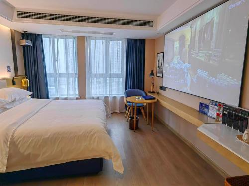 Imagen de la habitación del Hotel Kyriad Marvelous Henan Xinyang Pingqiao Plaza. Foto 15