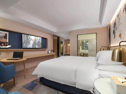 Imagen de la habitación del Hotel Kyriad Marvelous Henan Xinyang Pingqiao Plaza. Foto 17