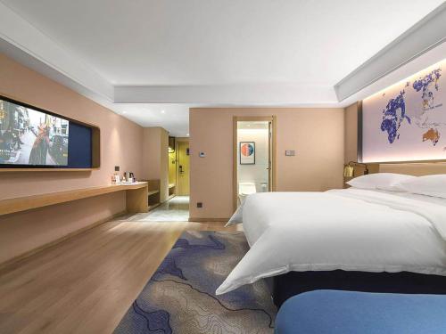 Imagen de la habitación del Hotel Kyriad Marvelous Henan Xinyang Pingqiao Plaza. Foto 18