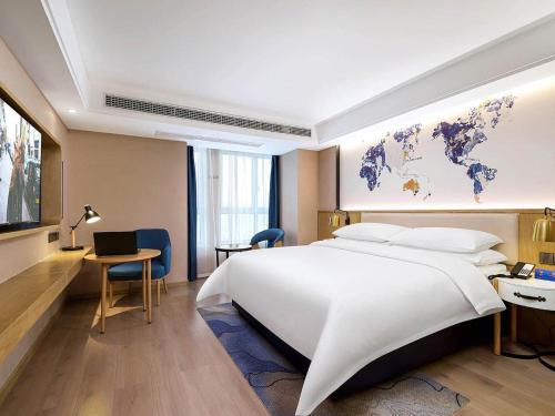 Imagen de la habitación del Hotel Kyriad Marvelous Henan Xinyang Pingqiao Plaza. Foto 19
