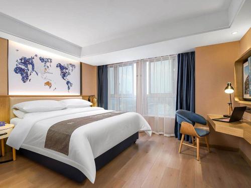 Imagen de la habitación del Hotel Kyriad Marvelous Henan Xinyang Pingqiao Plaza. Foto 20