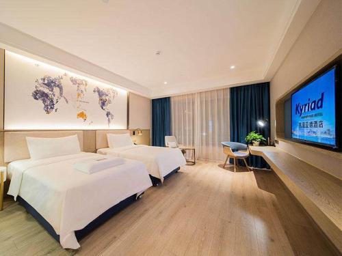 Imagen de la habitación del Hotel Kyriad Marvelous Heyuan Hakka Culture Park. Foto 12