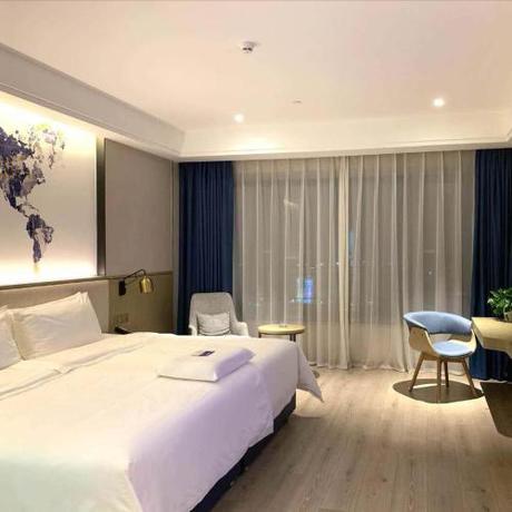 Imagen de la habitación del Hotel Kyriad Marvelous Heyuan Hakka Culture Park. Foto 13