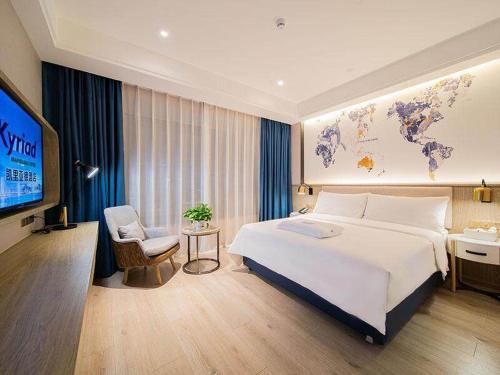Imagen de la habitación del Hotel Kyriad Marvelous Heyuan Hakka Culture Park. Foto 15