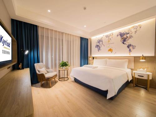 Imagen de la habitación del Hotel Kyriad Marvelous Heyuan Hakka Culture Park. Foto 16