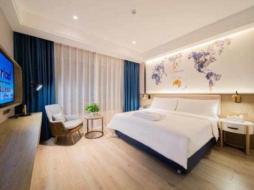 Imagen de la habitación del Hotel Kyriad Marvelous Heyuan Hakka Culture Park. Foto 18