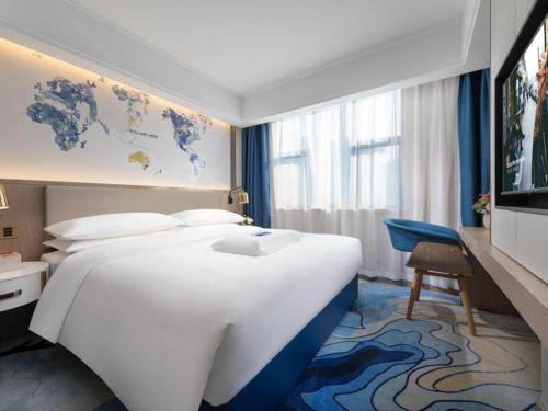 Imagen de la habitación del Hotel Kyriad Marvelous Heyuan Longchuan. Foto 14