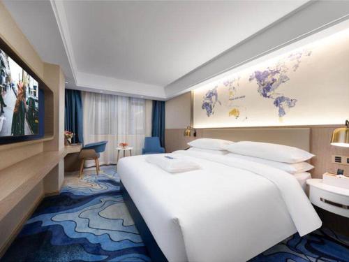 Imagen de la habitación del Hotel Kyriad Marvelous Heyuan Longchuan. Foto 15