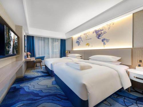 Imagen de la habitación del Hotel Kyriad Marvelous Heyuan Longchuan. Foto 16