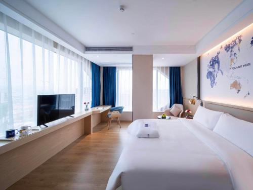 Imagen de la habitación del Hotel Kyriad Marvelous Heyuan Wanda Plaza. Foto 12