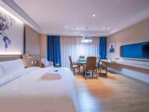 Imagen de la habitación del Hotel Kyriad Marvelous Heyuan Wanda Plaza. Foto 18